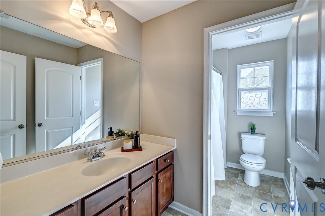14800 Diamond Creek Terrace, Midlothian, VA 23113 The hall bath grants separate vanity space from the shower and the water closet!