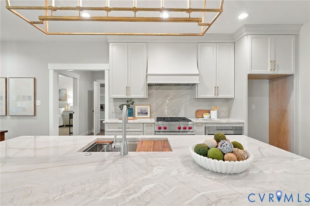 14010 Summercliff Trail, Chesterfield, VA 23832 Great Photo of the Custom Hood Fan & Wolf Dual Fuel Range Not to Mention the Elkay Workstation Sink!