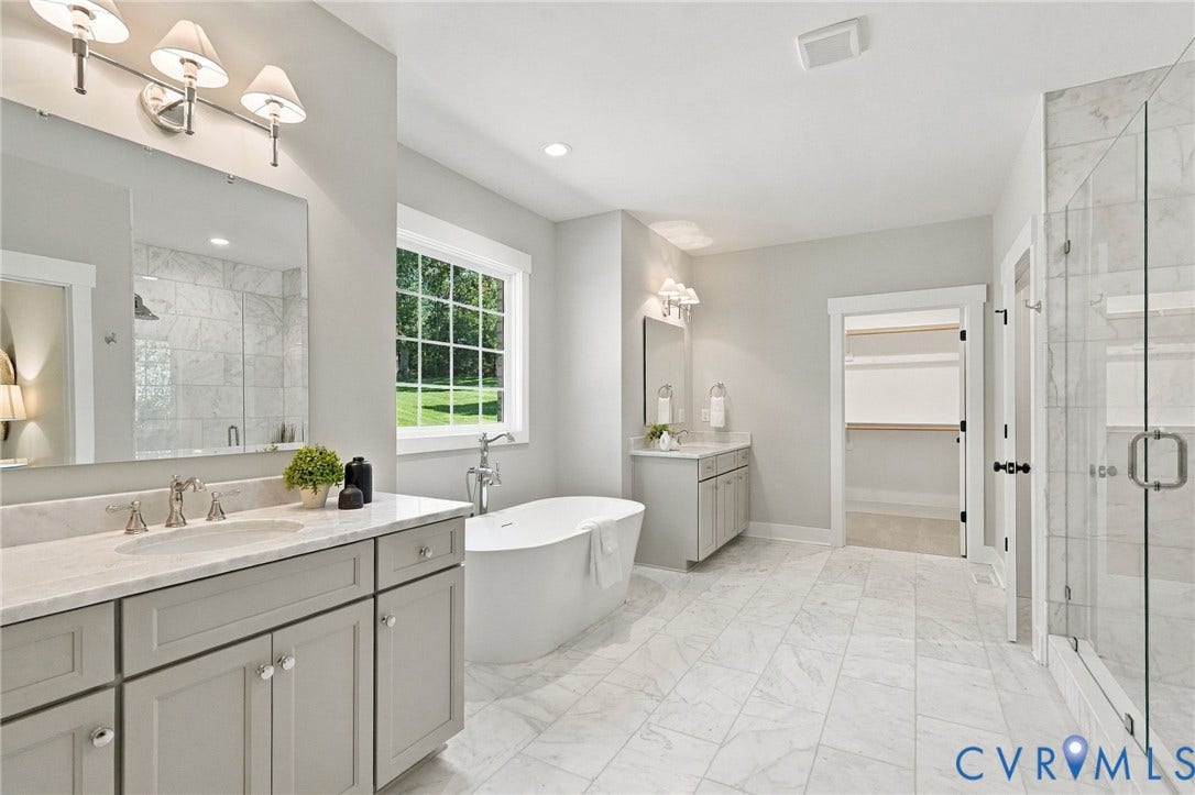 14010 Summercliff Trail, Chesterfield, VA 23832 Stunning is the Only Way to Describe the Primary Bathroom--Carrera Marble Floors, 2 Large Vanities w/Marble Tops, Large Walk-In Carrera Marble Shower & Soaking Tub