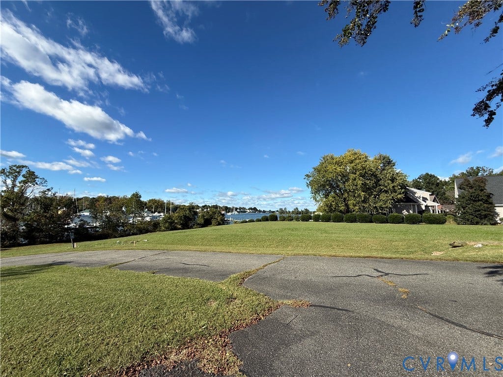 #30 Molly's Way, Urbanna, VA 23175 Expansive green lawn with a water backdrop