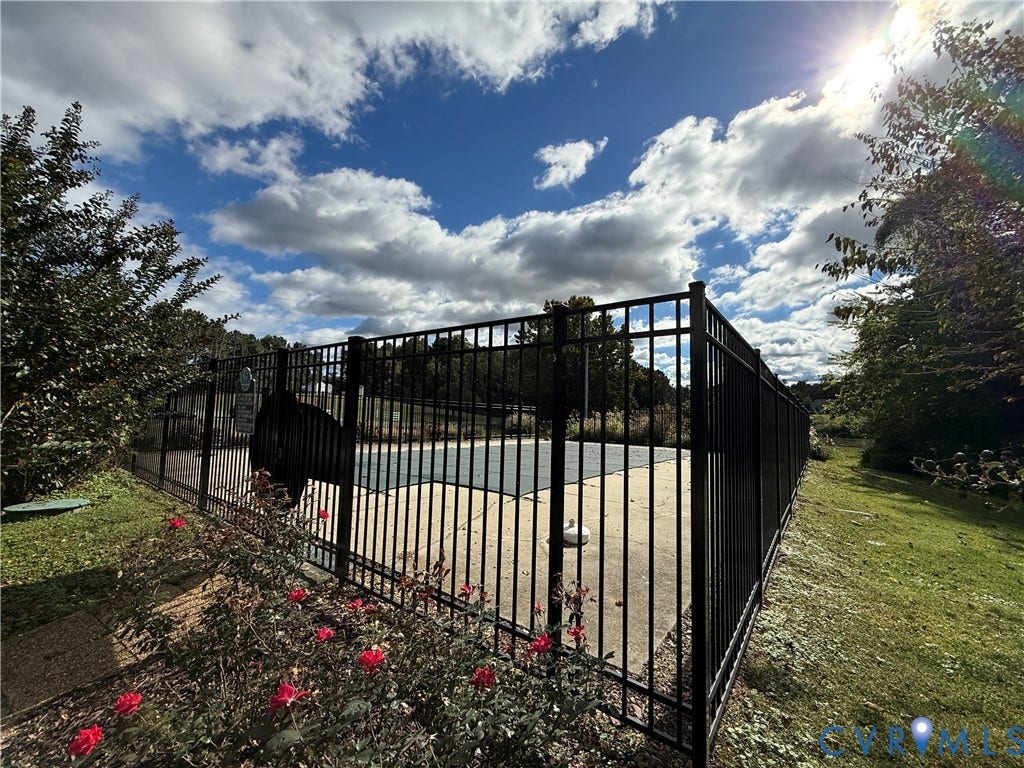 #30 Molly's Way, Urbanna, VA 23175 Fenced outdoor pool area with surrounding natural landscaping