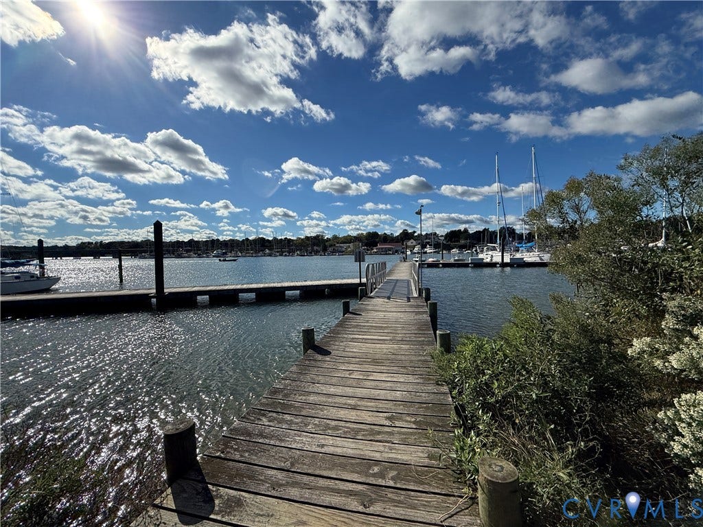#30 Molly's Way, Urbanna, VA 23175 Wooden dock extending over water, with a floating dock section