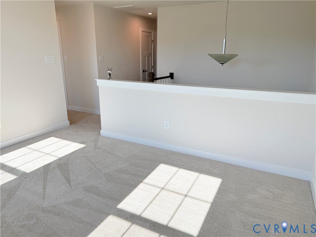 14225 Botsford Avenue, Wellspring, Chester, VA 23831 Neutral wall-to-wall carpeting, half-wall partition with white trim, and a contemporary pendant light fixture