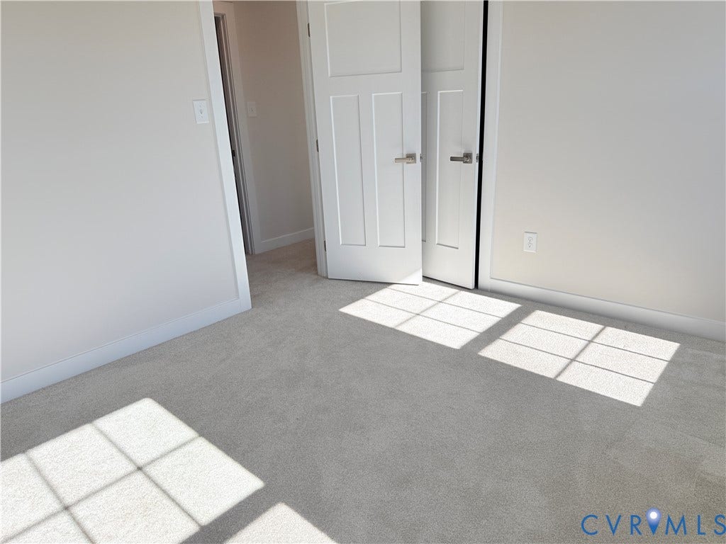 14225 Botsford Avenue, Wellspring, Chester, VA 23831 Neutral-toned carpeting, shaker-style interior doors, and modern satin nickel hardware