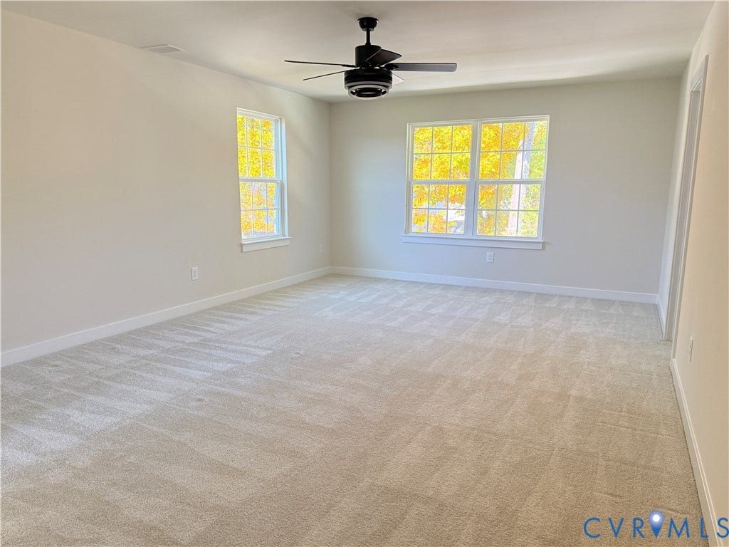 14225 Botsford Avenue, Wellspring, Chester, VA 23831 Neutral wall tones, wall-to-wall carpeting, multi-pane windows, and a ceiling fan with integrated lighting