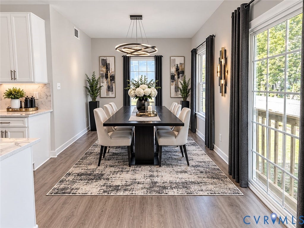 14225 Botsford Avenue, Wellspring, Chester, VA 23831 Virtually Staged Dining area featuring wood-finish flooring, a modern multi-ring chandelier, glass sliding doors with grid detailing, and recessed under-cabinet lighting