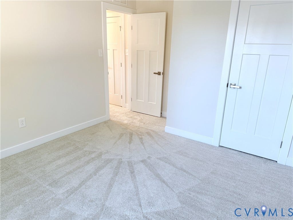 14225 Botsford Avenue, Wellspring, Chester, VA 23831 Neutral wall-to-wall carpeting, three-panel interior doors, and modern satin-nickel hardware