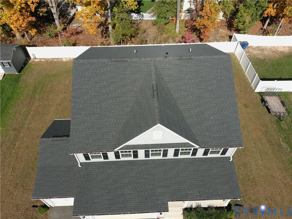 14225 Botsford Avenue, Wellspring, Chester, VA 23831 Aerial perspective featuring an asphalt shingle roof, gabled roofline, detached storage shed, and perimeter vinyl fencing