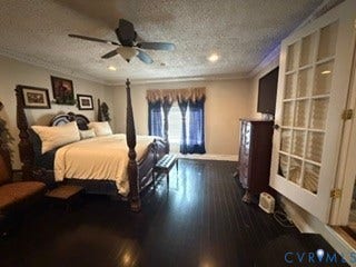 Dark wood-finish flooring, ceiling fan with integrated lighting, recessed lighting, crown molding, and French doors