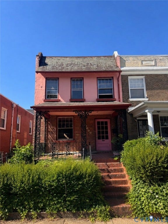 2309 Idlewood Avenue, Byrd Park, Richmond, VA 23220 Two-story pink stucco exterior with a slate shingle roof