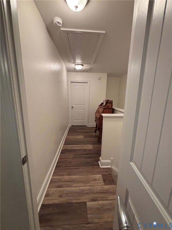 6722 Gibe Lane, Chesterfield, VA 23234 Hallway featuring wood-finish flooring, two flush-mount ceiling light fixtures, a multi-panel door, and a ceiling access panel