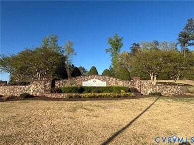 7580 Southamptonshire Way, Autumn Pines, New Kent, VA 23124 Stone entry monument featuring mature landscaping and established trees