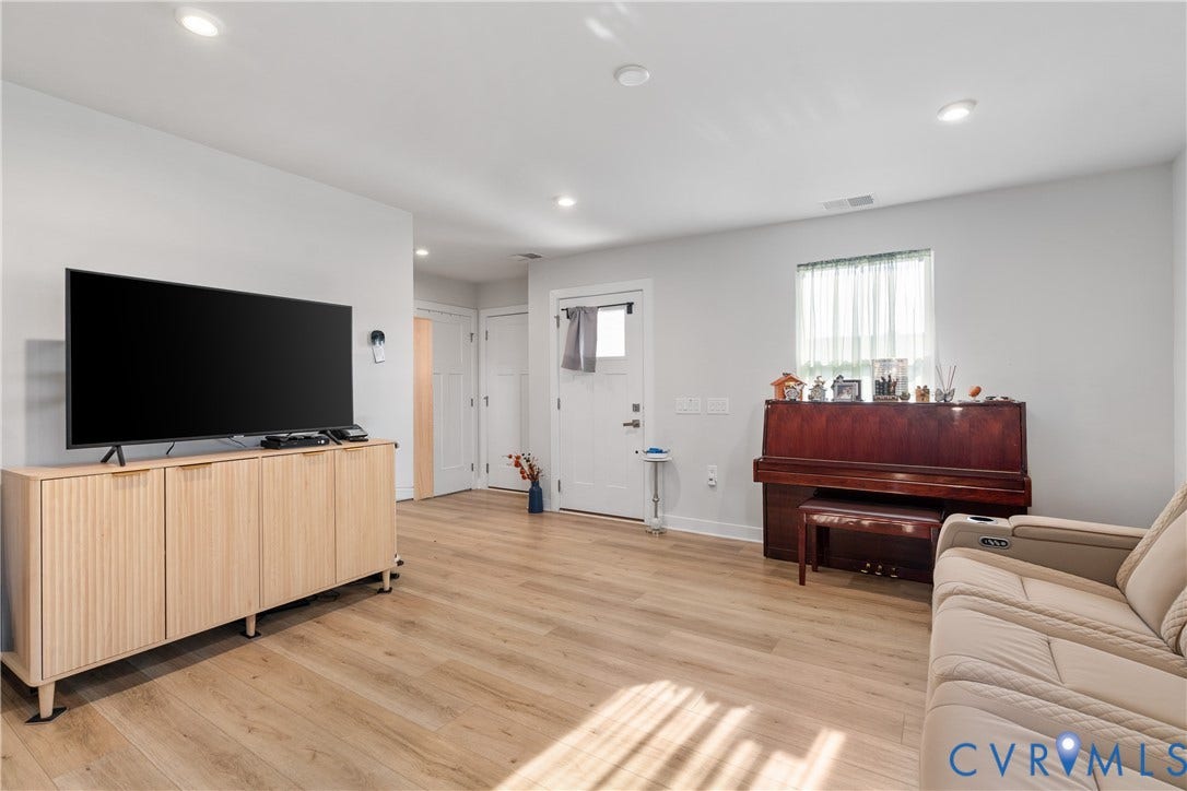 7580 Southamptonshire Way, Autumn Pines, New Kent, VA 23124 Recessed lighting, light-toned wood-finish flooring, white walls, and a front entry door with a divided light window