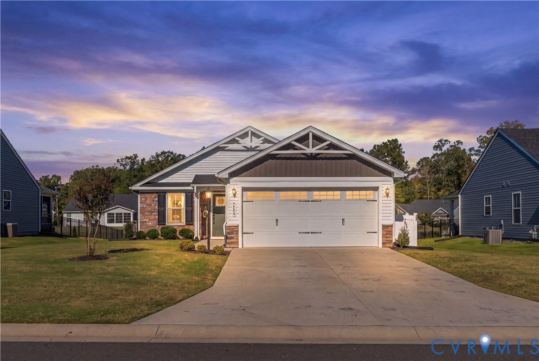 7580 Southamptonshire Way, Autumn Pines, New Kent, VA 23124 Exterior featuring a gabled roofline, mixed material facade with brick and siding, a two-car garage, concrete driveway, and a manicured lawn