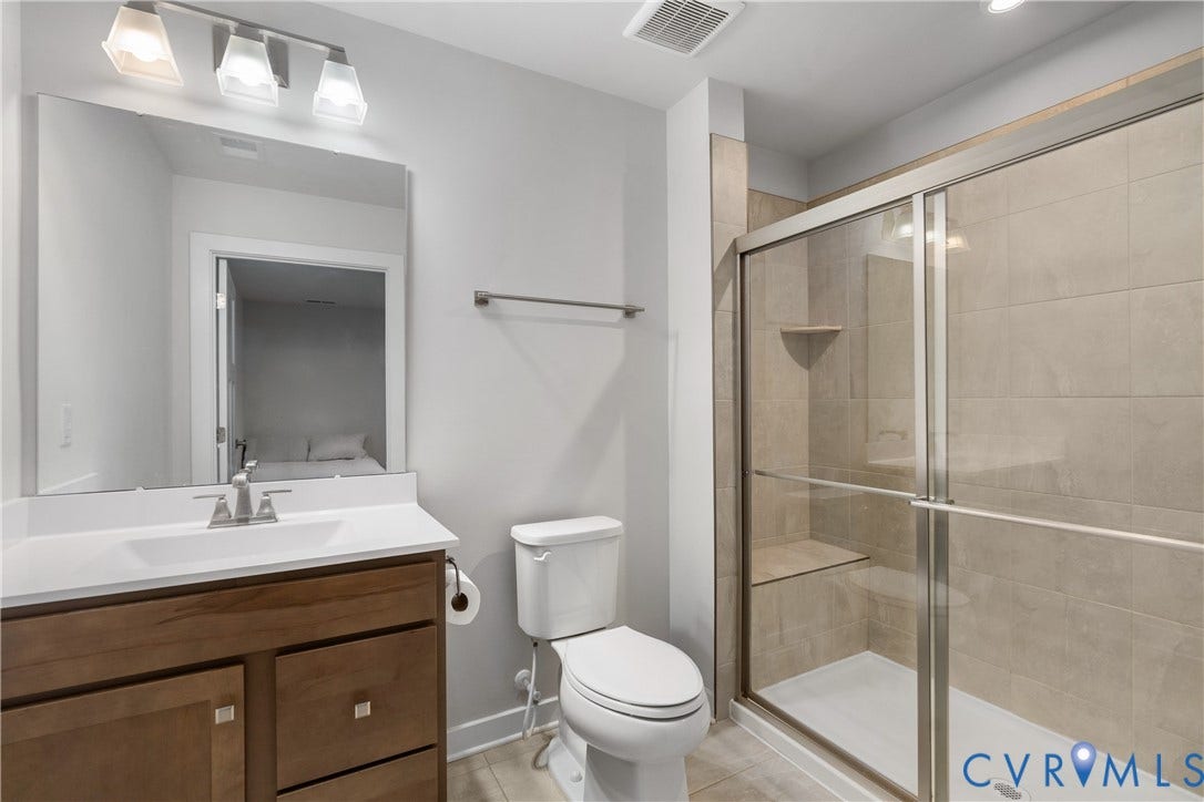 7580 Southamptonshire Way, Autumn Pines, New Kent, VA 23124 Vanity with wood-finish cabinetry, white countertop, and rectangular undermount sink