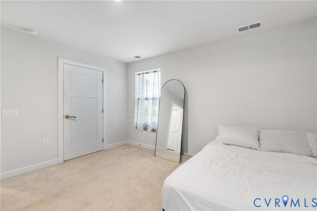 7580 Southamptonshire Way, Autumn Pines, New Kent, VA 23124 Recessed ceiling lighting, three-panel interior door, light-toned carpeting, and a window with natural light