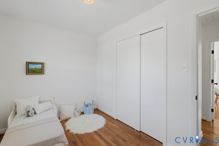 20306 Sheffield Place, Laurel Branch Farms, South Chesterfield, VA 23803 Hardwood flooring, white painted walls, and a built-in closet with sliding doors
