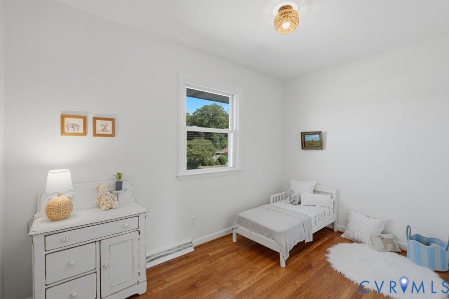 20306 Sheffield Place, Laurel Branch Farms, South Chesterfield, VA 23803 Hardwood-finish flooring, white painted walls, single window, and a woven-detail ceiling light fixture