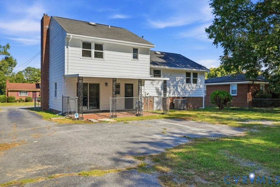20306 Sheffield Place, Laurel Branch Farms, South Chesterfield, VA 23803 Two-story residence with white siding and a brick chimney
