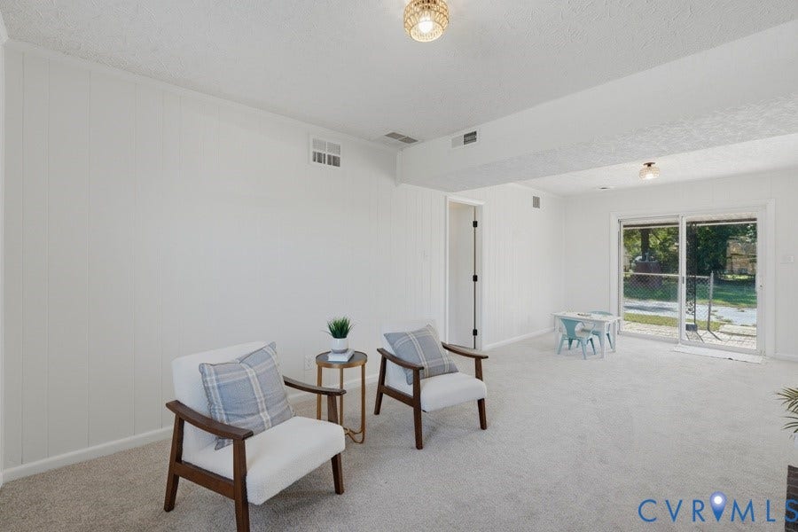 20306 Sheffield Place, Laurel Branch Farms, South Chesterfield, VA 23803 Carpeted living space with vertical paneling, recessed lighting, and a sliding glass door