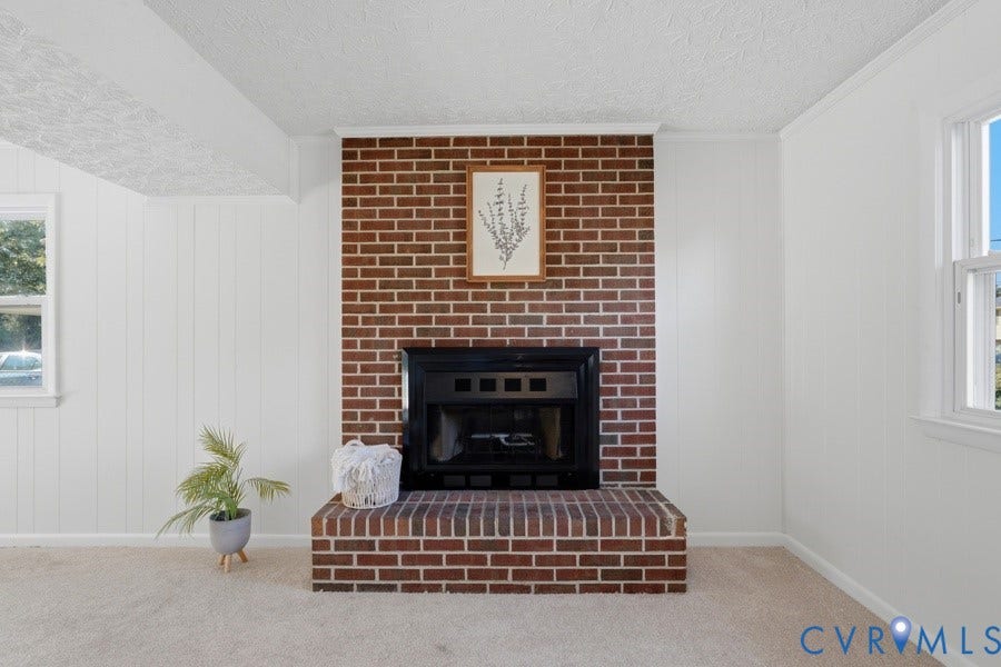 20306 Sheffield Place, Laurel Branch Farms, South Chesterfield, VA 23803 Bright and airy living space anchored by a striking brick fireplace with black insert and hearth
