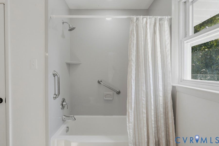 20306 Sheffield Place, Laurel Branch Farms, South Chesterfield, VA 23803 White tub and shower combination with chrome fixtures and built-in shelving