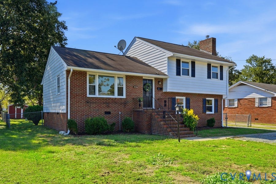 20306 Sheffield Place, Laurel Branch Farms, South Chesterfield, VA 23803 Brick and siding exterior with a dark shingle roof, featuring white-framed windows, dark shutters, and a front entry porch with brick steps