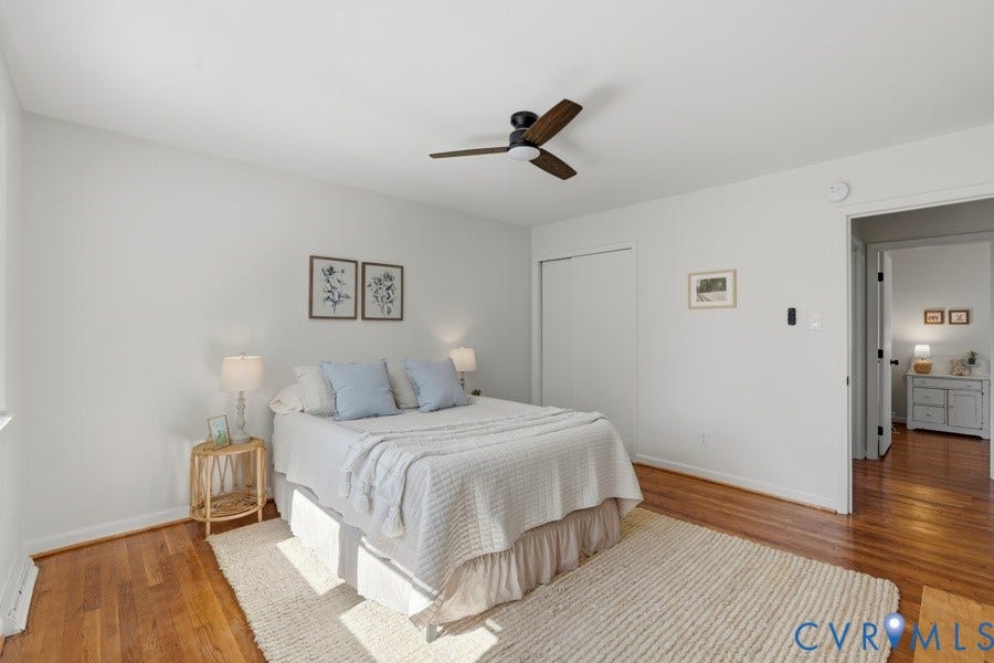 20306 Sheffield Place, Laurel Branch Farms, South Chesterfield, VA 23803 Hardwood flooring, white painted walls, ceiling fan with dark wood-finish blades, and a closet with bifold doors