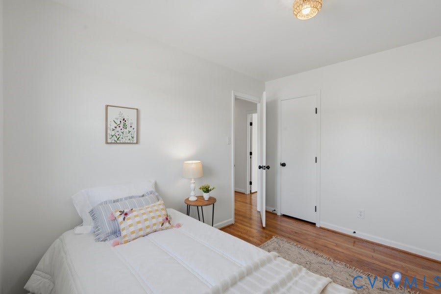 20306 Sheffield Place, Laurel Branch Farms, South Chesterfield, VA 23803 Hardwood flooring, crisp white walls, white doors, and a woven ceiling light fixture