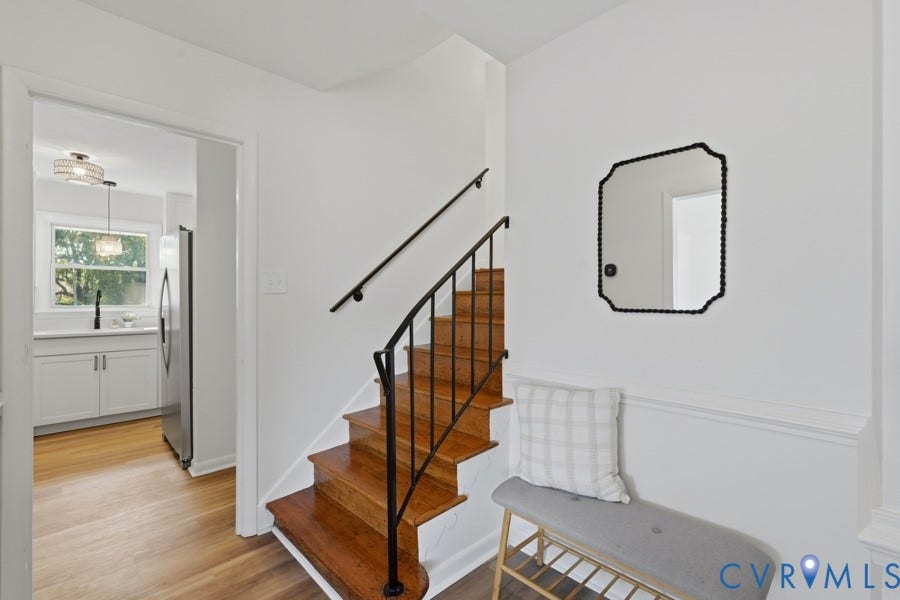 20306 Sheffield Place, Laurel Branch Farms, South Chesterfield, VA 23803 Hardwood staircase with wrought iron railing, white paneled walls, and wood-finish flooring