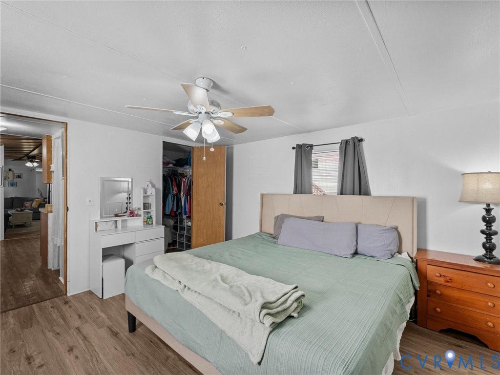 17009 Lansmill Drive, South Chesterfield, VA 23834 Wood-finish flooring throughout, ceiling fan with integrated lighting, and a window with blinds