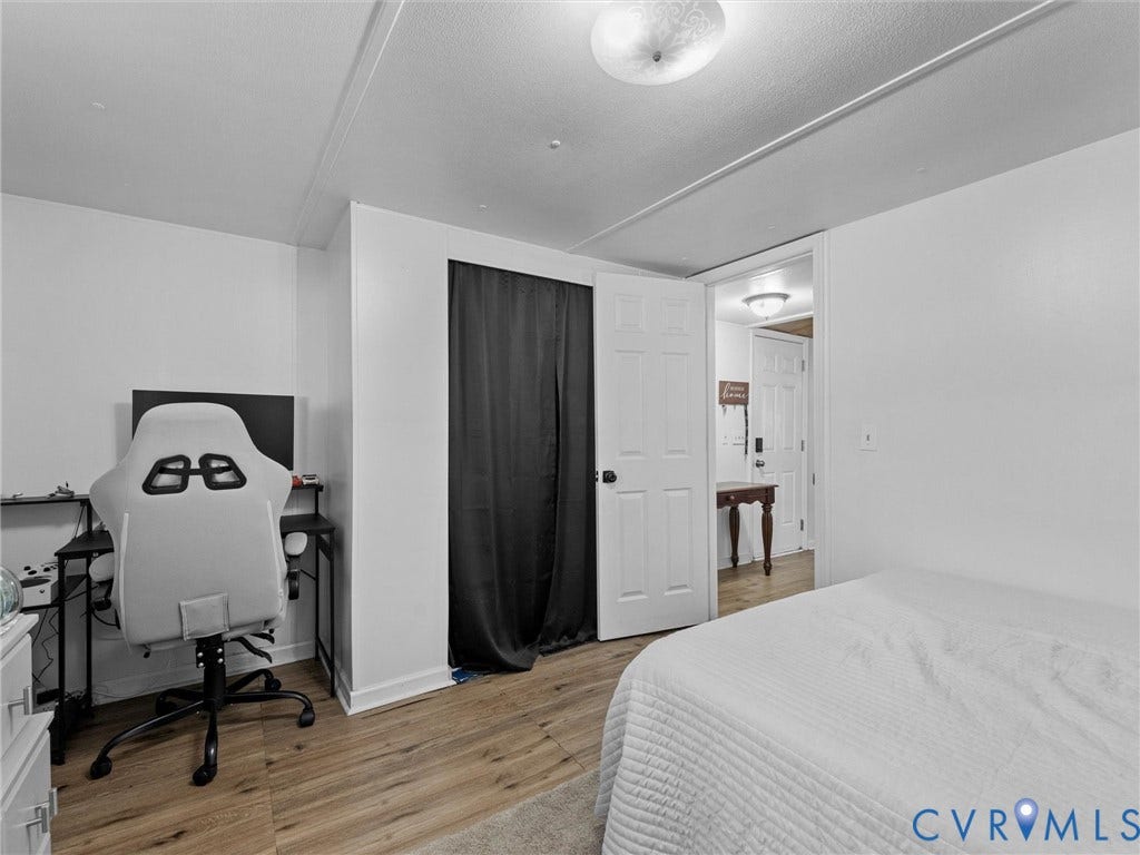 17009 Lansmill Drive, South Chesterfield, VA 23834 Wood-finish flooring throughout, white paneled interior doors, and a ceiling-mounted light fixture