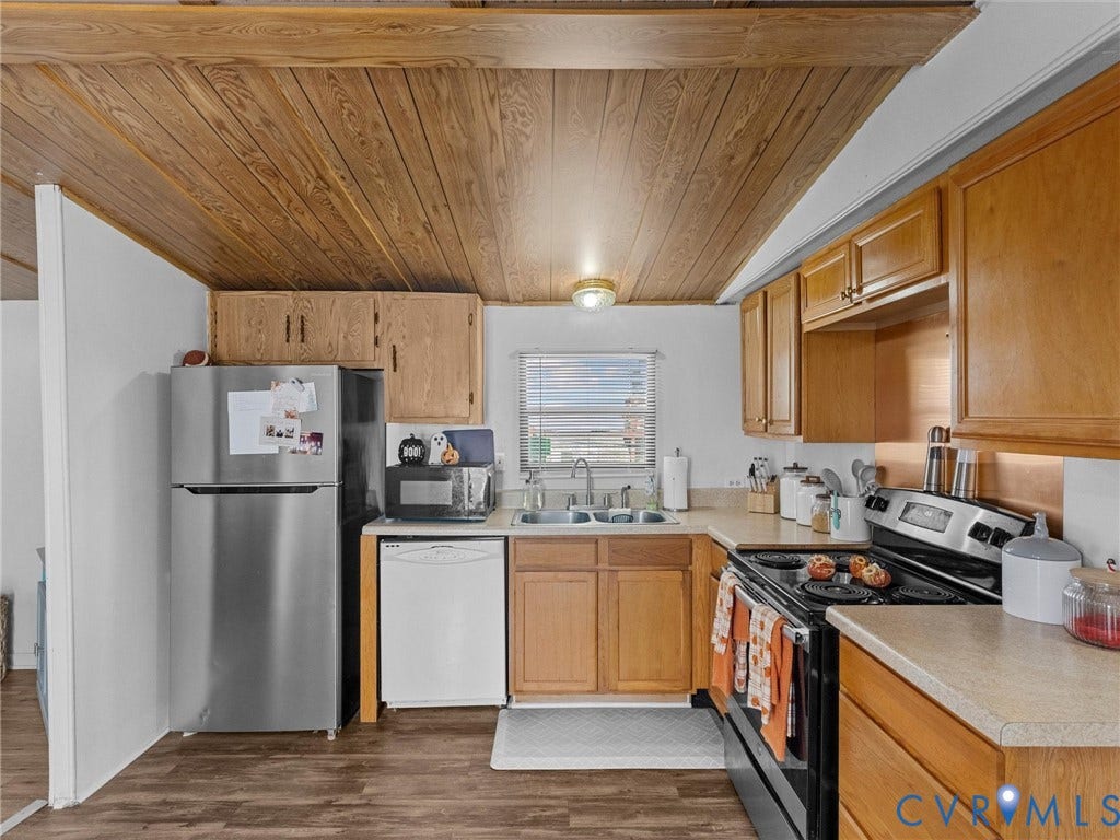 17009 Lansmill Drive, South Chesterfield, VA 23834 Wood-finish ceiling, wood-finish flooring, wood cabinetry, stainless steel refrigerator, and a built-in dishwasher
