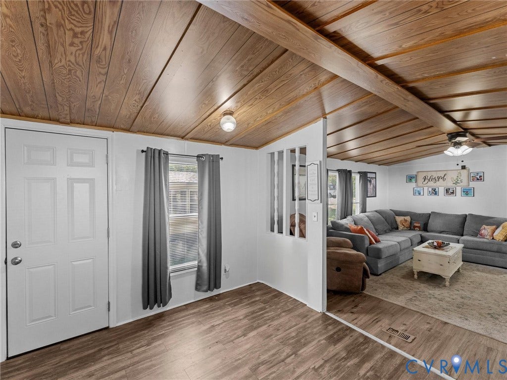 17009 Lansmill Drive, South Chesterfield, VA 23834 Wood-finish flooring throughout, complemented by a wood-paneled ceiling