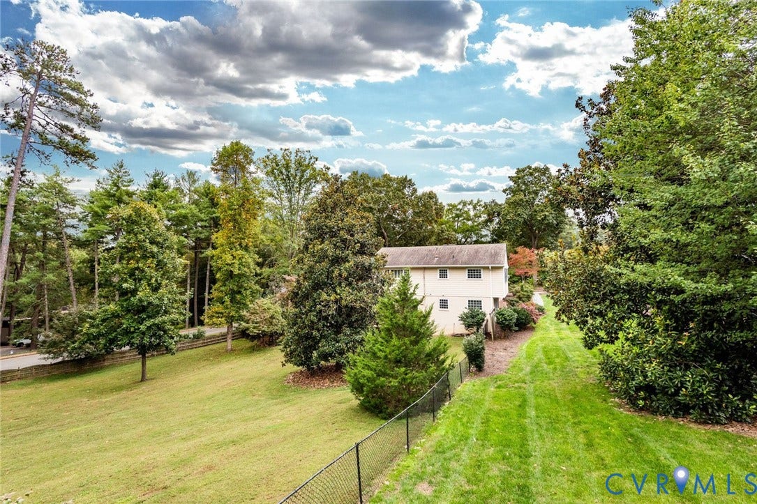 207 Tarrytown Drive, Sleepy Hollow, Henrico, VA 23229 Nearly an acre of privacy, this sweeping lawn provides ample space for recreation and relaxation.