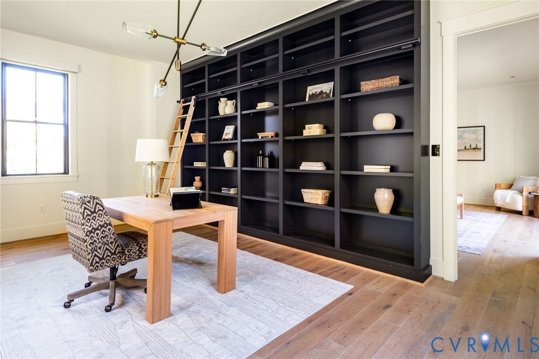 1136 Getaway Lane, Tuckahoe Creek, Goochland, VA 23103 Private primary ensuite office with custom libary built-ins featuring rolling ladder and bright natural light.