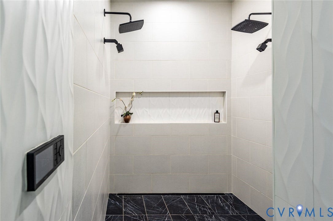 1136 Getaway Lane, Tuckahoe Creek, Goochland, VA 23103 Spa-inspired primary ensuite with seamless shower featuring dual shower heads and custom niche with designer tile.