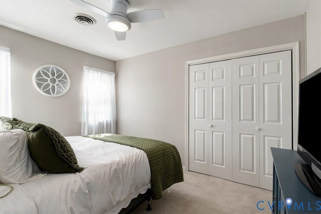 863 Watch Hill Road, Midlothian, VA 23114 Bright secondary bedroom with neutral wall finishes, ceiling fan, and abundant natural light from dual windows