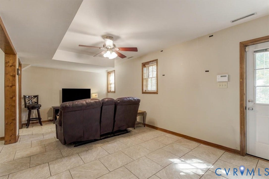 863 Watch Hill Road, Midlothian, VA 23114 Recessed ceiling section with a ceiling fan, light-toned tile flooring, and wood-framed windows