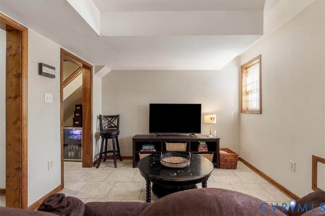 863 Watch Hill Road, Midlothian, VA 23114 Spacious recreation room featuring neutral tile flooring, recessed ceiling lighting, and warm wood-finish trim throughout