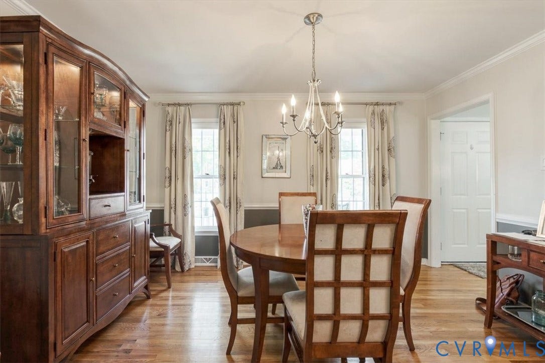 863 Watch Hill Road, Midlothian, VA 23114 Formal dining room showcasing hardwood flooring, a wood pedestal dining table with upholstered chairs, and a chandelier pendant light fixture