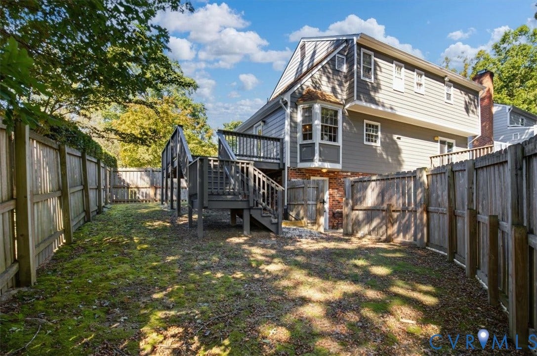863 Watch Hill Road, Midlothian, VA 23114 Expansive backyard featuring a multi-level deck, wood fencing, and mature trees