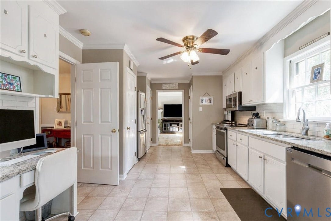 863 Watch Hill Road, Midlothian, VA 23114 Kitchen featuring white cabinetry, light-toned tile flooring, stainless steel appliances, and a built-in desk area