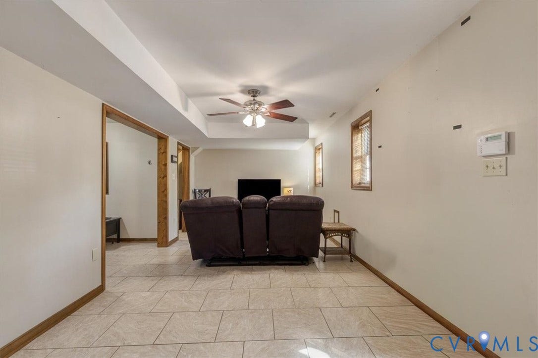 863 Watch Hill Road, Midlothian, VA 23114 Spacious living area showcasing ceramic tile flooring, recessed lighting, and a ceiling fan with integrated light fixture