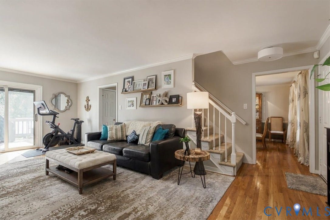 863 Watch Hill Road, Midlothian, VA 23114 Sliding glass door, light-colored walls, wood-finish flooring, white staircase with railing, recessed lighting