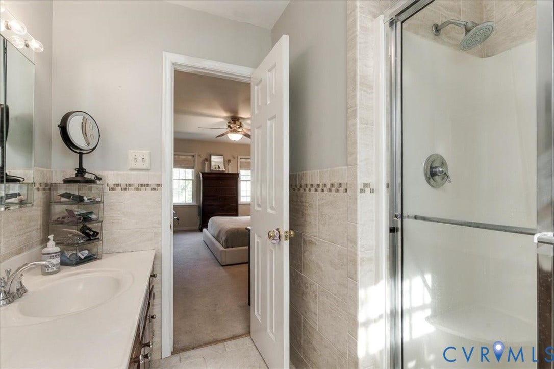 863 Watch Hill Road, Midlothian, VA 23114 Bathroom featuring a vanity with an integrated sink, polished chrome faucet, and overhead lighting