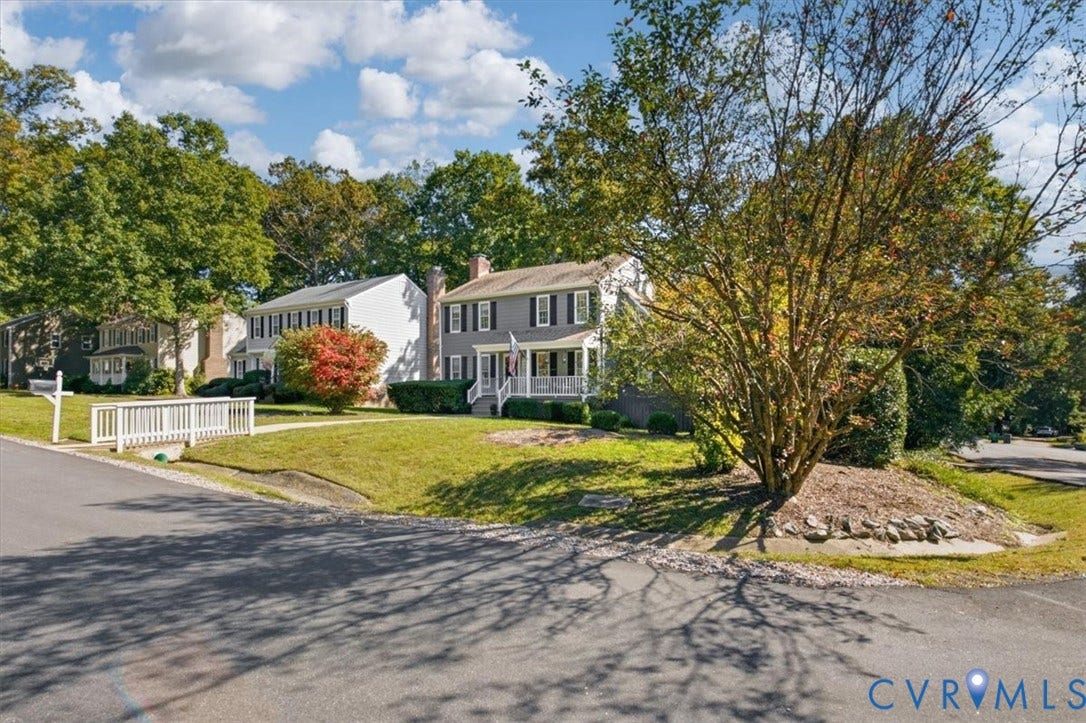 863 Watch Hill Road, Midlothian, VA 23114 Two-story residence with a gray facade, white porch, and black shutters