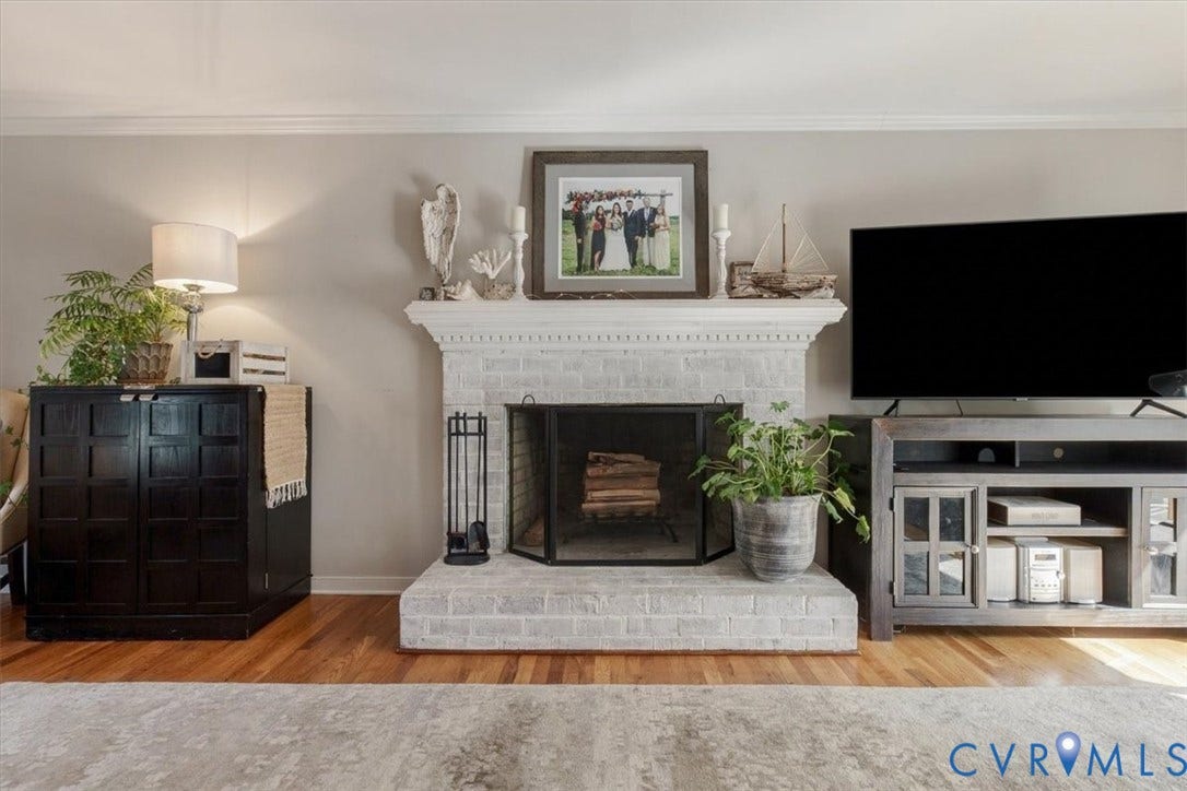 863 Watch Hill Road, Midlothian, VA 23114 Painted brick fireplace with a decorative mantel and hearth