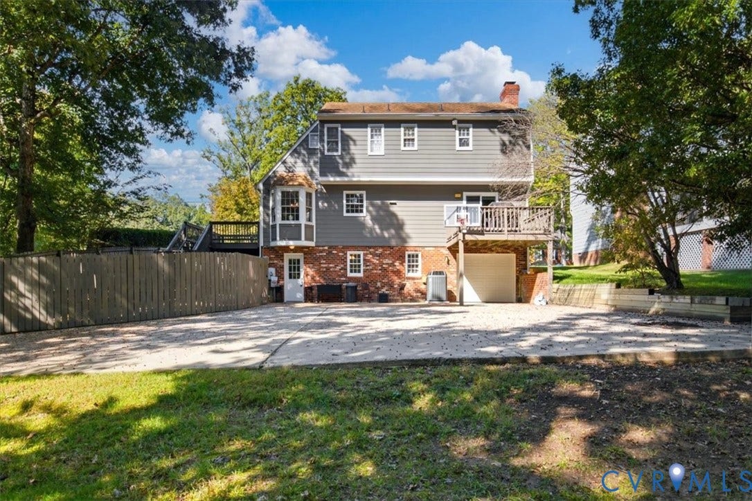 863 Watch Hill Road, Midlothian, VA 23114 Multilevel exterior with brick and siding, featuring a bay window, upper-level deck, and integrated garage