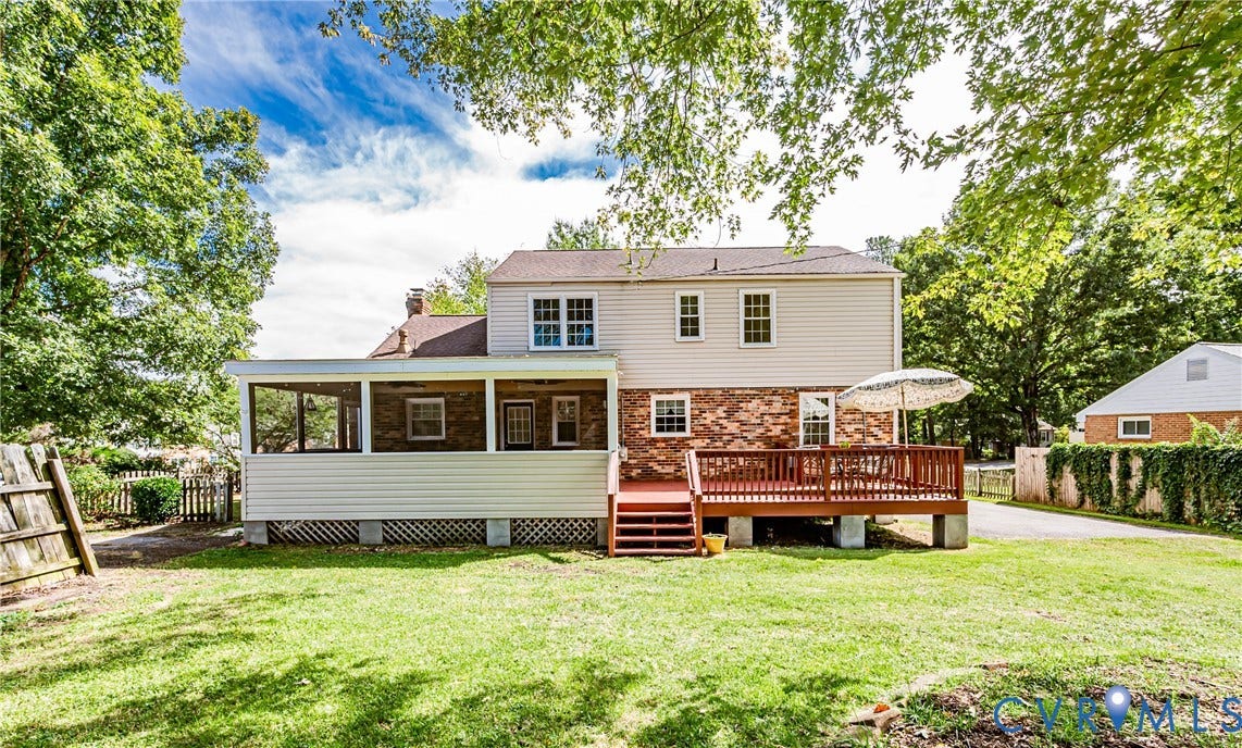 1608 Lochwood Drive, Henrico, VA 23238 Expansive backyard featuring a screened porch, a multi-level wood deck, and a combination of brick and siding exterior